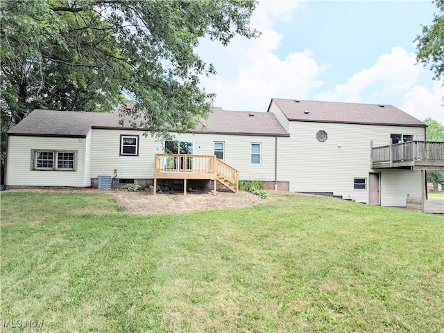 9306 Beech St, Louisville, OH 44641 - back of property with a deck and a lawn