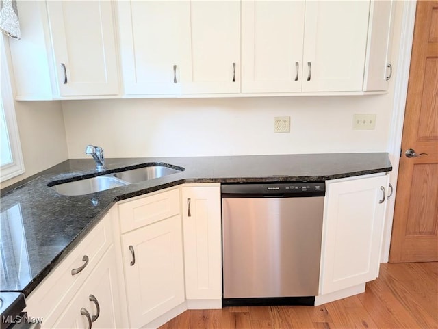 9306 Beech St, Louisville, OH 44641 - kitchen with stainless steel dishwasher, white cabinets, and dark stone countertops