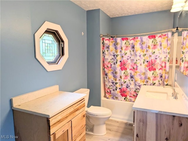 9306 Beech St, Louisville, OH 44641 - full bathroom featuring vanity, wood finished floors, shower / tub combo, and a textured ceiling