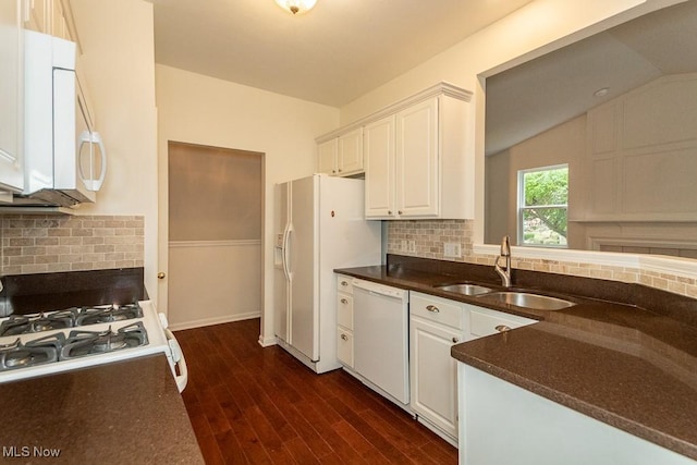 583 Mock Orange Cir, Chagrin Falls, OH 44023 - kitchen featuring white appliances, backsplash, vaulted ceiling, white cabinetry, and dark wood-type flooring