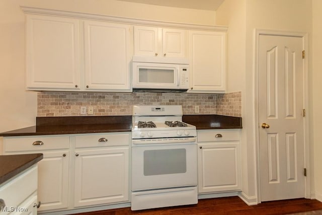 583 Mock Orange Cir, Chagrin Falls, OH 44023 - kitchen with white appliances, dark countertops, white cabinetry, and tasteful backsplash