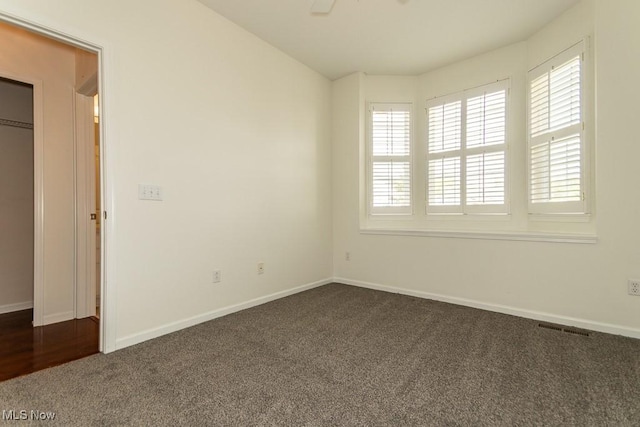 583 Mock Orange Cir, Chagrin Falls, OH 44023 - spare room with dark colored carpet and ceiling fan