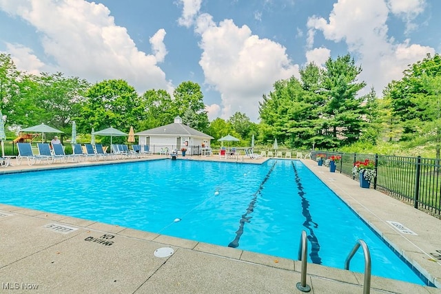 583 Mock Orange Cir, Chagrin Falls, OH 44023 - community pool featuring view of wooded area and a patio area