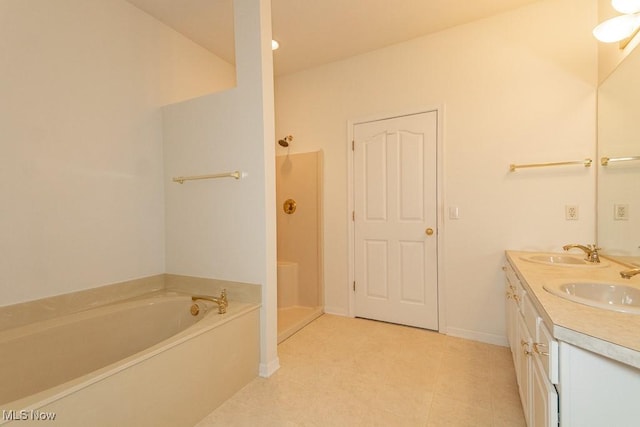 583 Mock Orange Cir, Chagrin Falls, OH 44023 - full bathroom with a garden tub, double vanity, walk in shower, and tile patterned floors