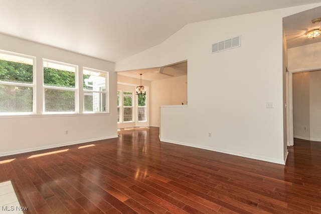 583 Mock Orange Cir, Chagrin Falls, OH 44023 - unfurnished living room with a chandelier, lofted ceiling, and wood finished floors