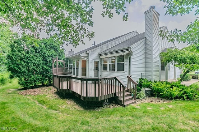 583 Mock Orange Cir, Chagrin Falls, OH 44023 - rear view of property featuring a deck, a lawn, and a chimney