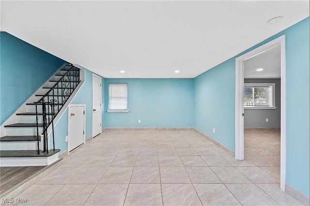 1552 E 254th St, Euclid, OH 44117 - unfurnished living room featuring stairs, tile patterned floors, and recessed lighting
