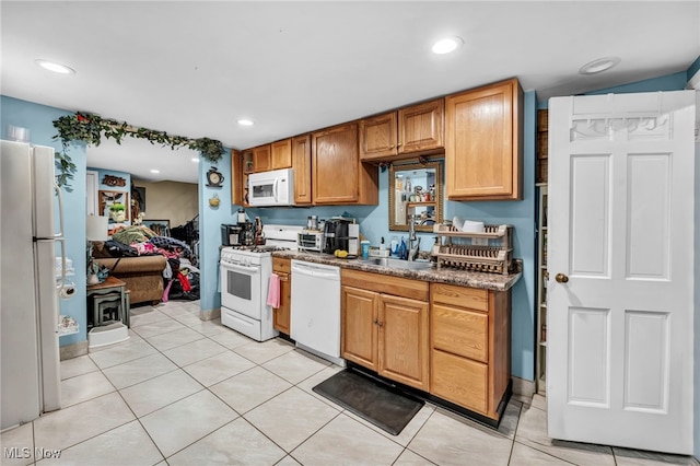 1552 E 254th St, Euclid, OH 44117 - kitchen featuring white appliances, light tile patterned flooring, and recessed lighting