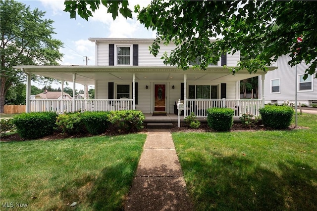 291 S Cleveland Ave, Mogadore, OH 44260 - farmhouse-style home with a front lawn and covered porch
