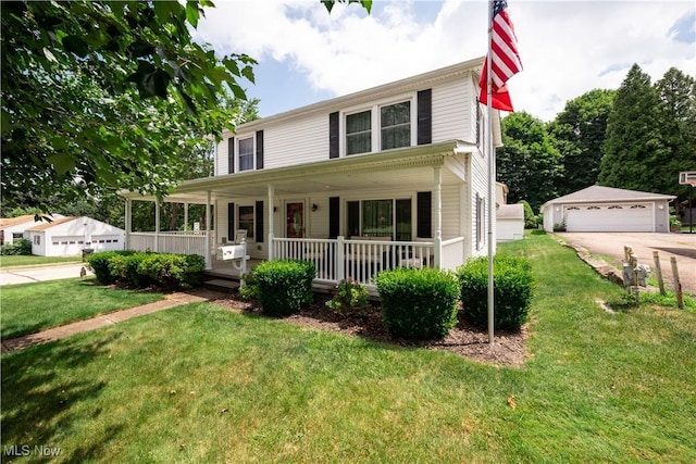 291 S Cleveland Ave, Mogadore, OH 44260 - view of front of property with a porch, a detached garage, and a front yard