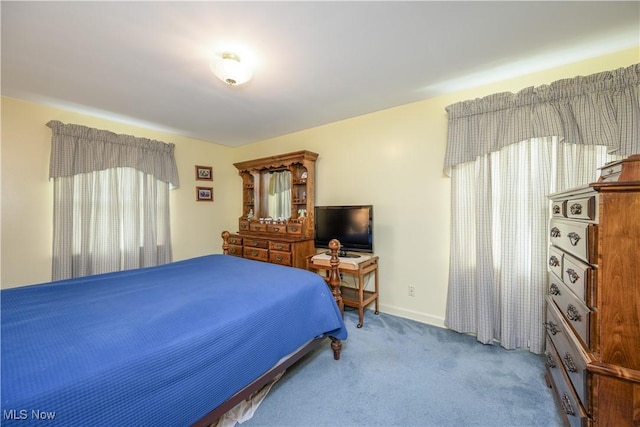 291 S Cleveland Ave, Mogadore, OH 44260 - carpeted bedroom featuring multiple windows