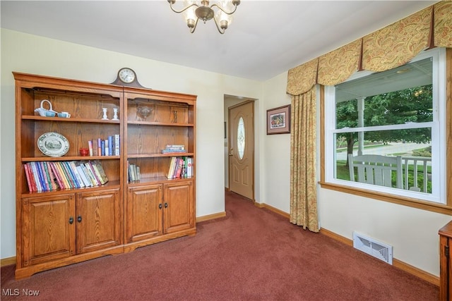 291 S Cleveland Ave, Mogadore, OH 44260 - foyer featuring a chandelier and carpet flooring