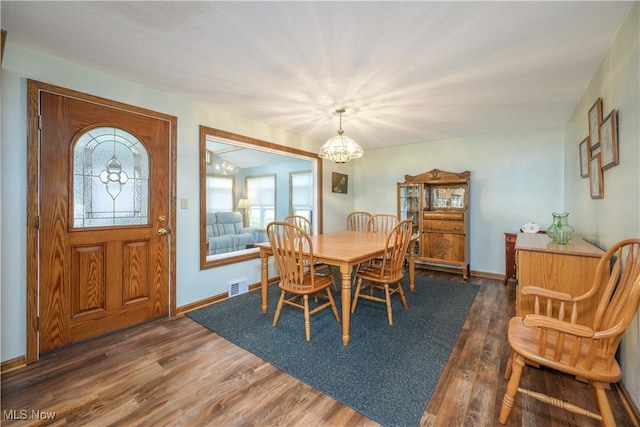 291 S Cleveland Ave, Mogadore, OH 44260 - dining space with a chandelier and wood finished floors
