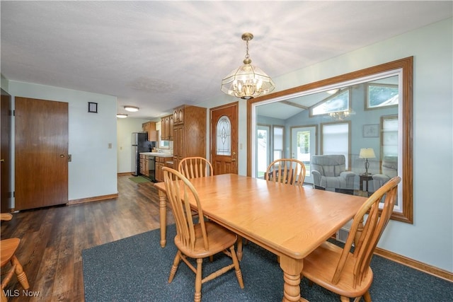 291 S Cleveland Ave, Mogadore, OH 44260 - dining room featuring a chandelier, dark wood finished floors, and lofted ceiling