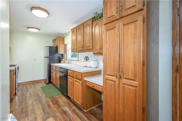 291 S Cleveland Ave, Mogadore, OH 44260 - kitchen with appliances with stainless steel finishes, light countertops, wood finished floors, and brown cabinetry