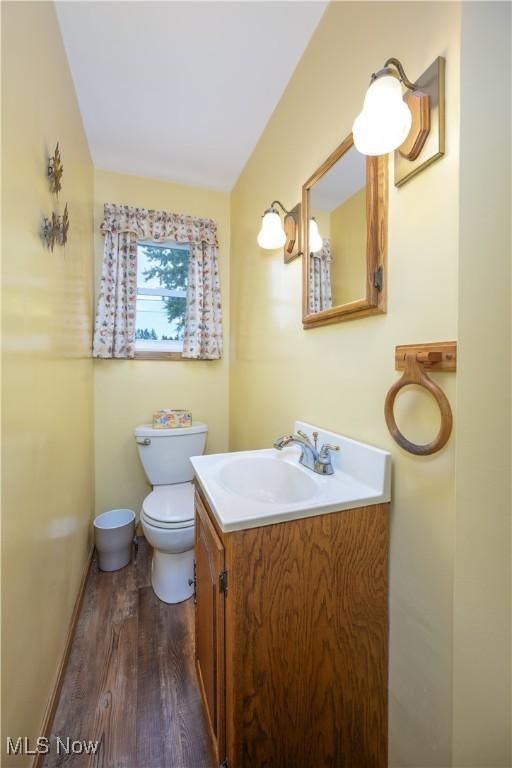 291 S Cleveland Ave, Mogadore, OH 44260 - half bath featuring vanity and wood finished floors
