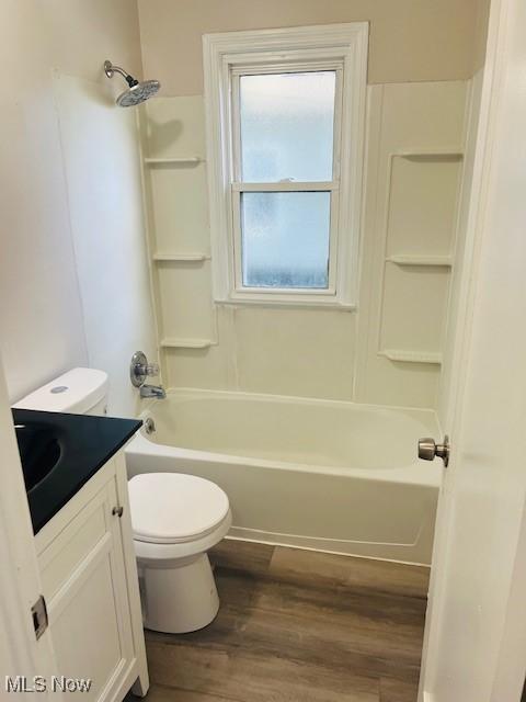 1700 Malasia Rd, Akron, OH 44305 - full bath featuring vanity, wood finished floors, and  shower combination