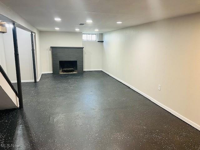 1700 Malasia Rd, Akron, OH 44305 - below grade area featuring a brick fireplace and recessed lighting
