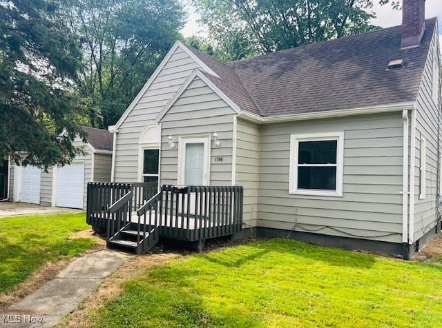 1700 Malasia Rd, Akron, OH 44305 - bungalow-style home featuring a deck, a chimney, a front yard, and a shingled roof