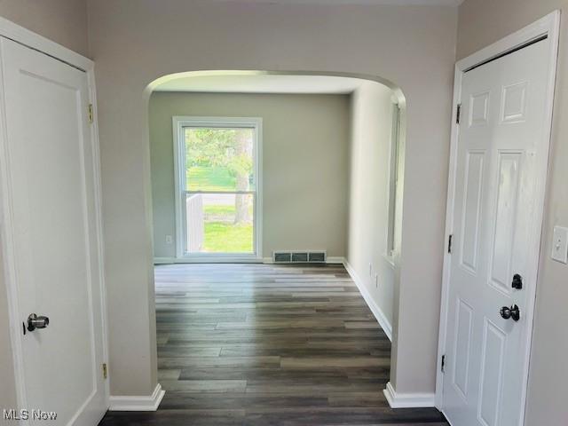 1700 Malasia Rd, Akron, OH 44305 - hall featuring arched walkways and wood finished floors