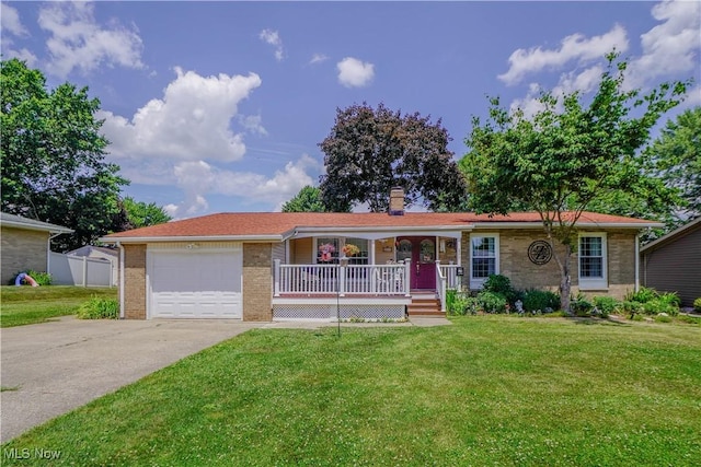 2077 Daniels Ave, Akron, OH 44312 - ranch-style home featuring covered porch, driveway, a front yard, and a garage