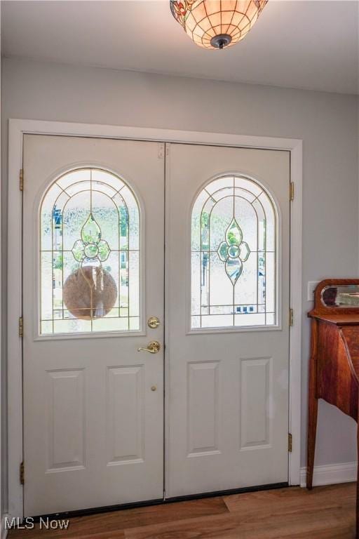 2077 Daniels Ave, Akron, OH 44312 - foyer featuring healthy amount of natural light and wood finished floors