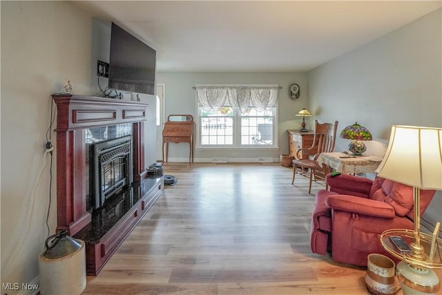 2077 Daniels Ave, Akron, OH 44312 - living room with wood finished floors and a tile fireplace