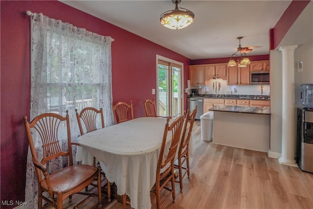 2077 Daniels Ave, Akron, OH 44312 - dining room with light wood-type flooring and ornate columns