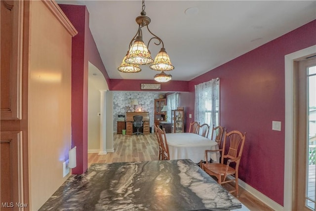 2077 Daniels Ave, Akron, OH 44312 - dining space featuring light wood-type flooring and arched walkways