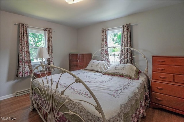 2077 Daniels Ave, Akron, OH 44312 - bedroom with wood finished floors and baseboard heating