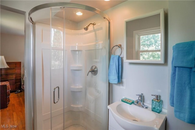 2077 Daniels Ave, Akron, OH 44312 - bathroom featuring a stall shower, vanity, and wood finished floors