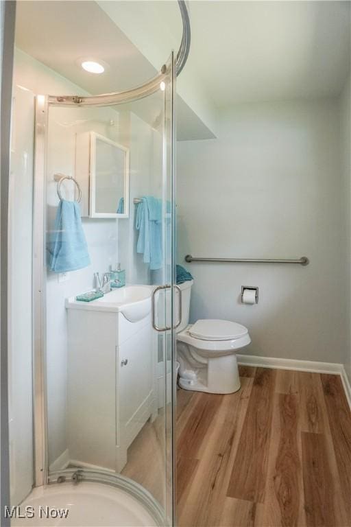 2077 Daniels Ave, Akron, OH 44312 - full bathroom featuring vanity, wood finished floors, and a shower stall