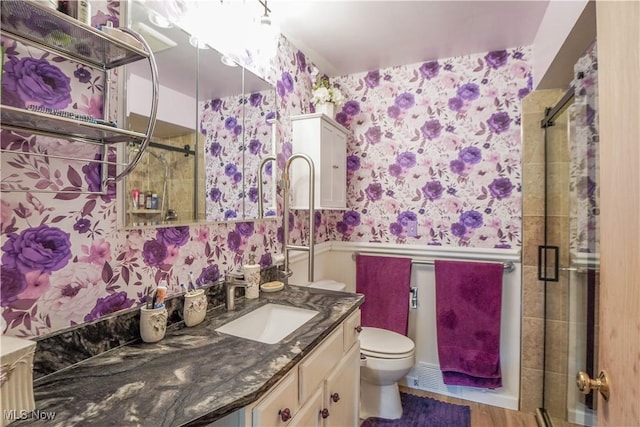 2077 Daniels Ave, Akron, OH 44312 - full bathroom featuring wallpapered walls, wainscoting, a shower stall, vanity, and wood finished floors