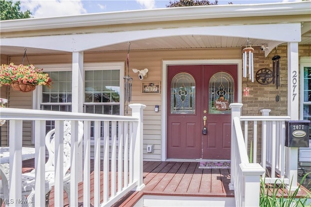 2077 Daniels Ave, Akron, OH 44312 - property entrance featuring covered porch