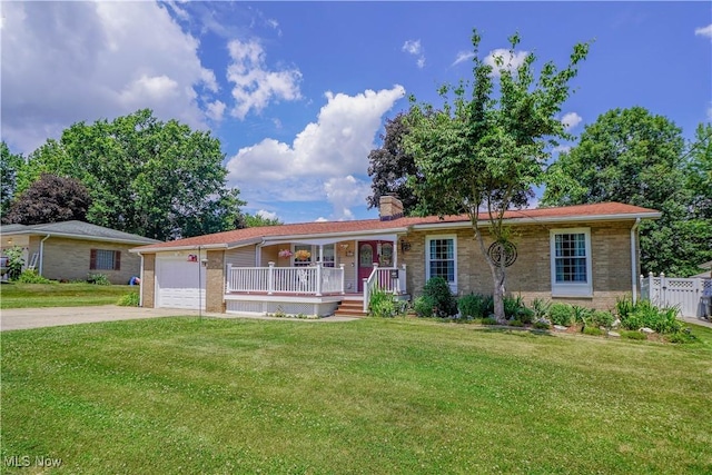 2077 Daniels Ave, Akron, OH 44312 - single story home with a porch, concrete driveway, an attached garage, a front yard, and a chimney
