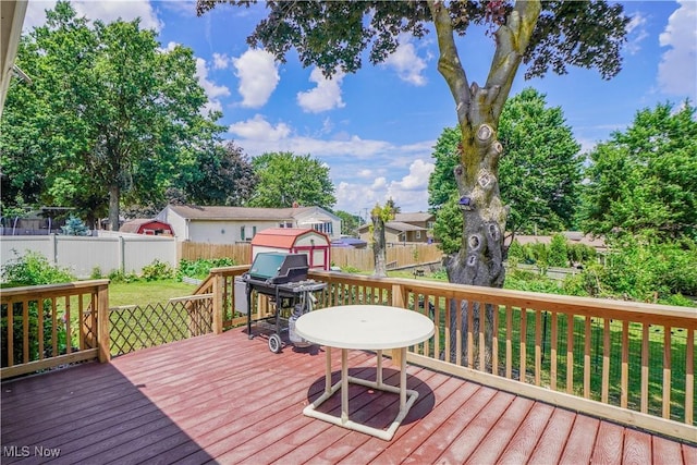2077 Daniels Ave, Akron, OH 44312 - wooden terrace with a shed, a fenced backyard, and area for grilling