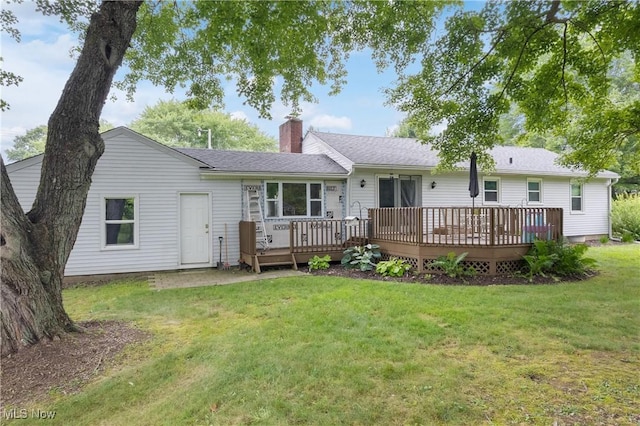 1332 Broadview Ave, Akron, OH 44321 - rear view of house featuring a chimney, a deck, and a lawn