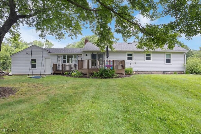 1332 Broadview Ave, Akron, OH 44321 - back of property featuring a wooden deck, a chimney, and a lawn