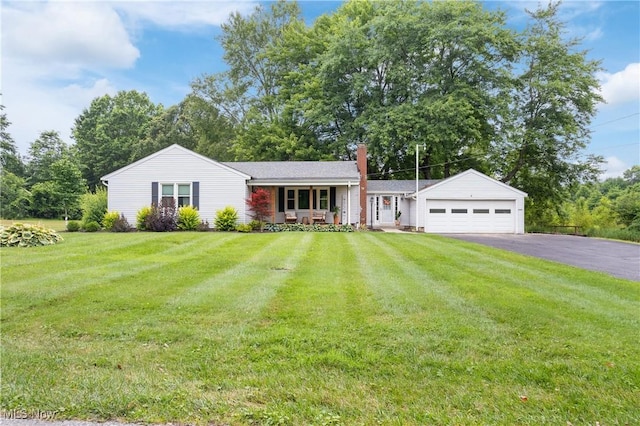 1332 Broadview Ave, Akron, OH 44321 - ranch-style house with asphalt driveway, a chimney, a front yard, an attached garage, and a porch