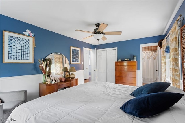 1332 Broadview Ave, Akron, OH 44321 - bedroom featuring a closet, a wainscoted wall, and a ceiling fan