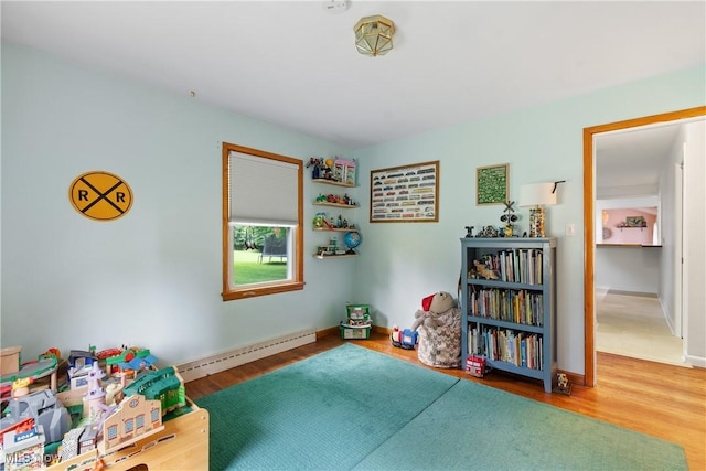 1332 Broadview Ave, Akron, OH 44321 - game room featuring a baseboard radiator and wood finished floors