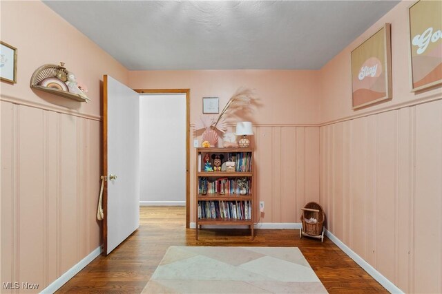 1332 Broadview Ave, Akron, OH 44321 - hallway featuring wood finished floors, wainscoting, and a decorative wall