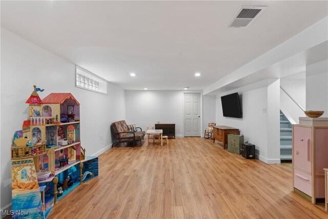 1332 Broadview Ave, Akron, OH 44321 - living area with light wood-type flooring, recessed lighting, and stairway