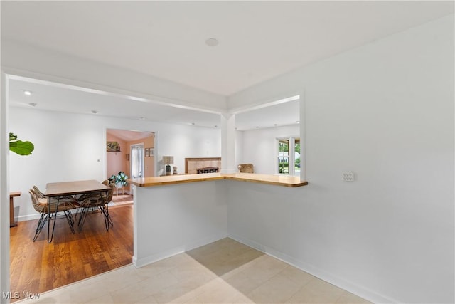 1332 Broadview Ave, Akron, OH 44321 - kitchen featuring baseboards and a peninsula