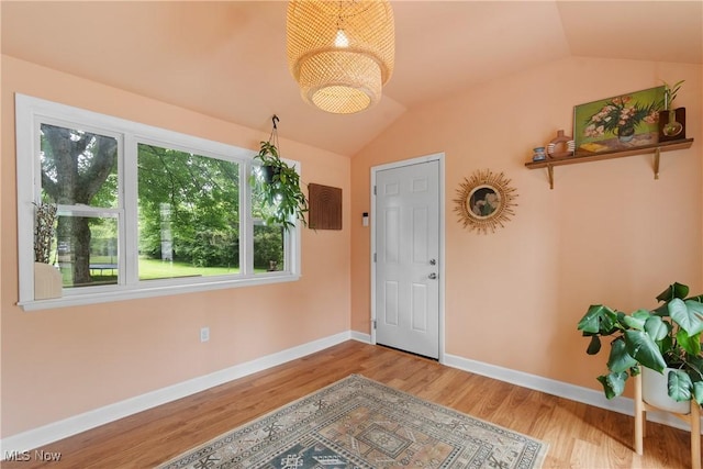 1332 Broadview Ave, Akron, OH 44321 - entrance foyer featuring vaulted ceiling, wood finished floors, and a chandelier