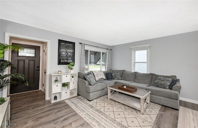 908 Dawnwood Dr, Parma, OH 44134 - living room featuring wood finished floors and baseboards