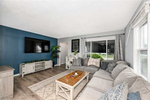 908 Dawnwood Dr, Parma, OH 44134 - living area featuring wood finished floors and baseboards