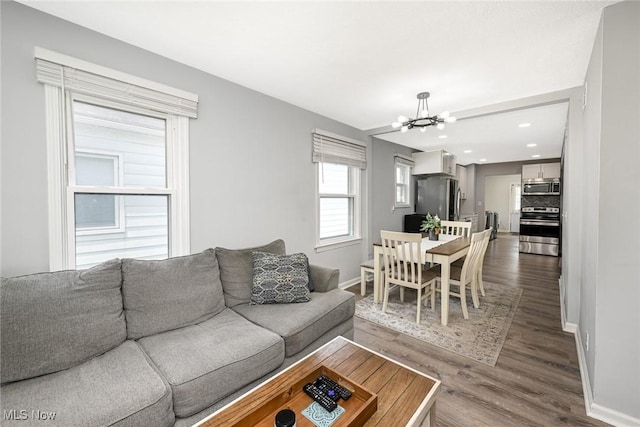 908 Dawnwood Dr, Parma, OH 44134 - living area featuring dark wood finished floors, a chandelier, and recessed lighting