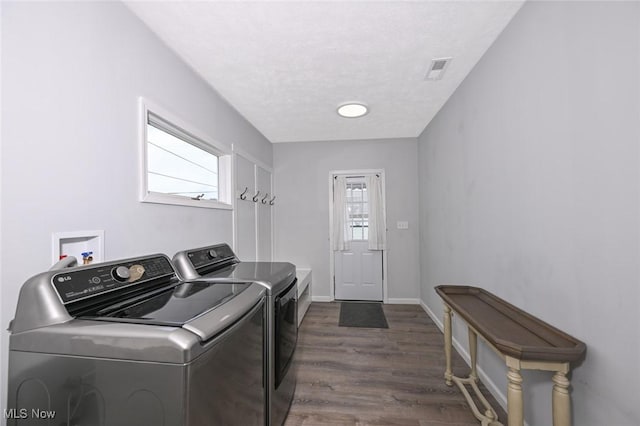 908 Dawnwood Dr, Parma, OH 44134 - washroom featuring washer and dryer and dark wood-type flooring