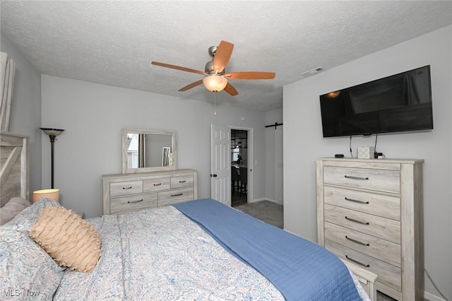 908 Dawnwood Dr, Parma, OH 44134 - bedroom featuring a ceiling fan and a textured ceiling